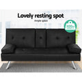 Black PU leather sofa bed in room showing 200kg capacity badge, chrome legs and bolster armrests