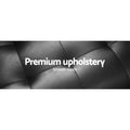Black PU leather sofa bed upholstery close-up showing pebbled grain texture with smooth touch caption