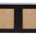 Black rattan TV unit close-up of two cane-weave door panels and black bar handles on black frame
