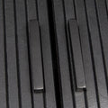 Close-up of black reeded sideboard showing two matte black square bar handles on reeded door panels