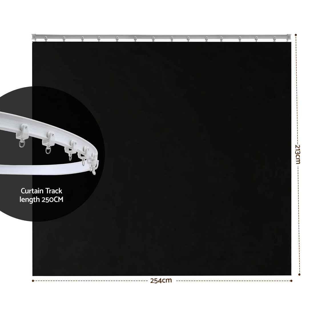 Black room divider curtain on white curved ceiling track in bedroom with grey bed sheer curtains plant and beige sofa