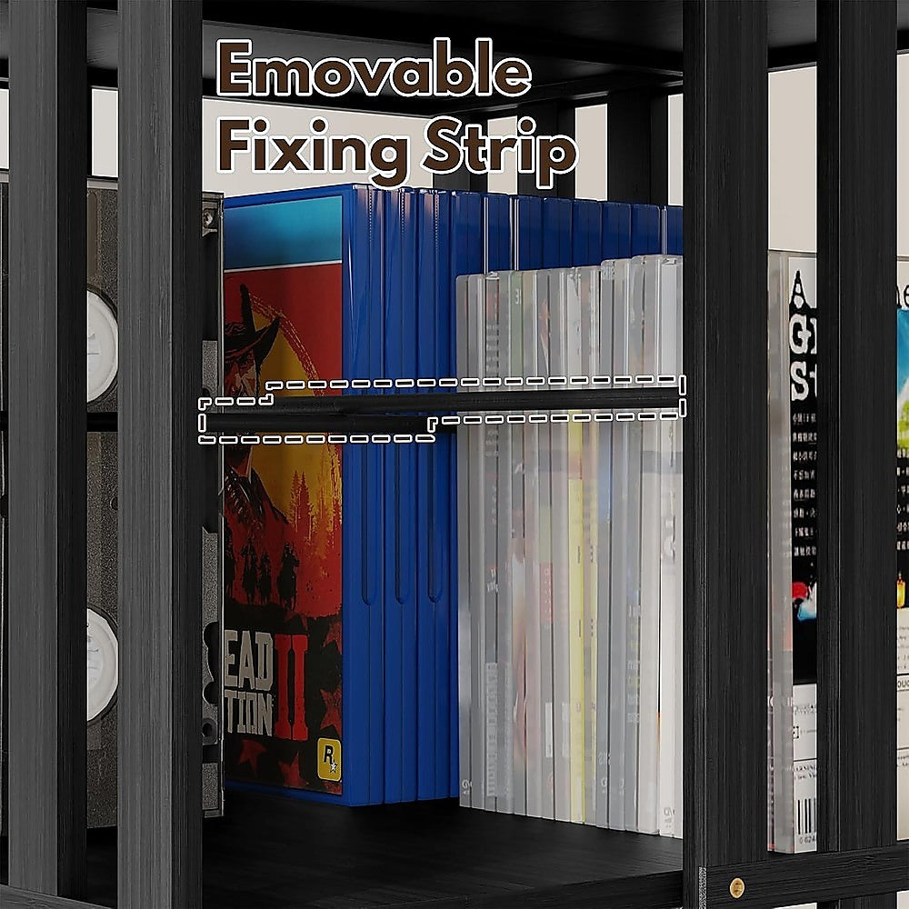 Close-up of black rotating media tower shelf loaded with game cases, dashed lines highlighting removable fixing strip