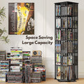 Black rotating media tower loaded with DVDs and CDs beside stacked disc pile, text overlay reads Space Saving Large Capacity