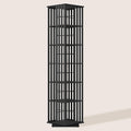 Black 6-tier rotating tower bookshelf with vertical slatted panels on all four sides, front view on beige background