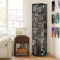 Black rotating tower bookshelf filled with CDs, DVDs and books in music room with turntable on side table and posters on wall