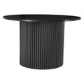 Black round coffee table with fluted cylindrical pedestal base and marble-look top on white background