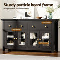 Black sideboard in room with capacity labels: 60kg top, 15kg drawers, 30kg shelves, books and vases visible inside