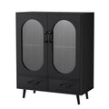 Black sideboard with two oval ribbed glass doors, two bottom drawers and tapered legs on white background