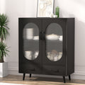 Black sideboard with two oval ribbed glass doors and two bottom drawers in lifestyle room setting