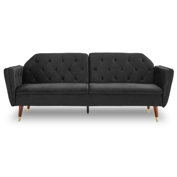 Black velvet tufted sofa bed with angled arms, button-tufted back and tapered walnut legs, front view