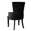 Black velvet wingback armchair rear view showing smooth back panel, arms, and black cabriole wood legs on white background