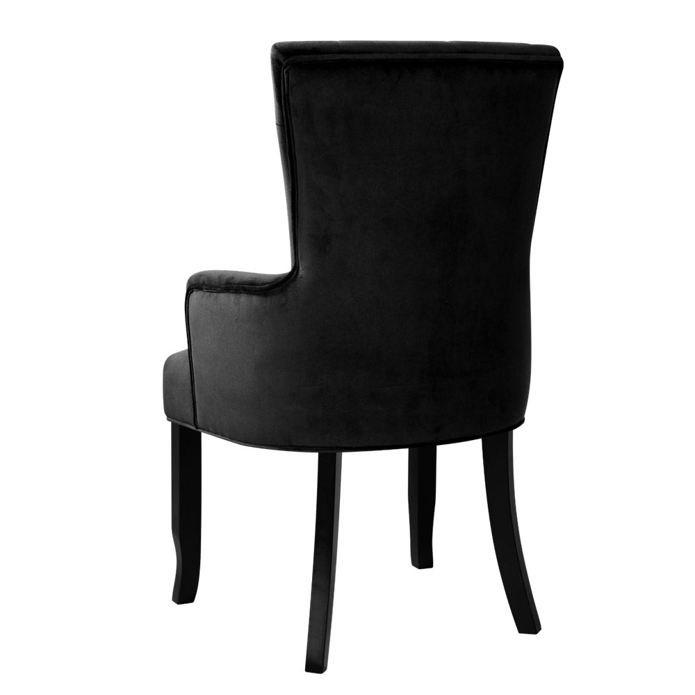 Black velvet wingback armchair rear view showing smooth back panel, arms, and black cabriole wood legs on white background