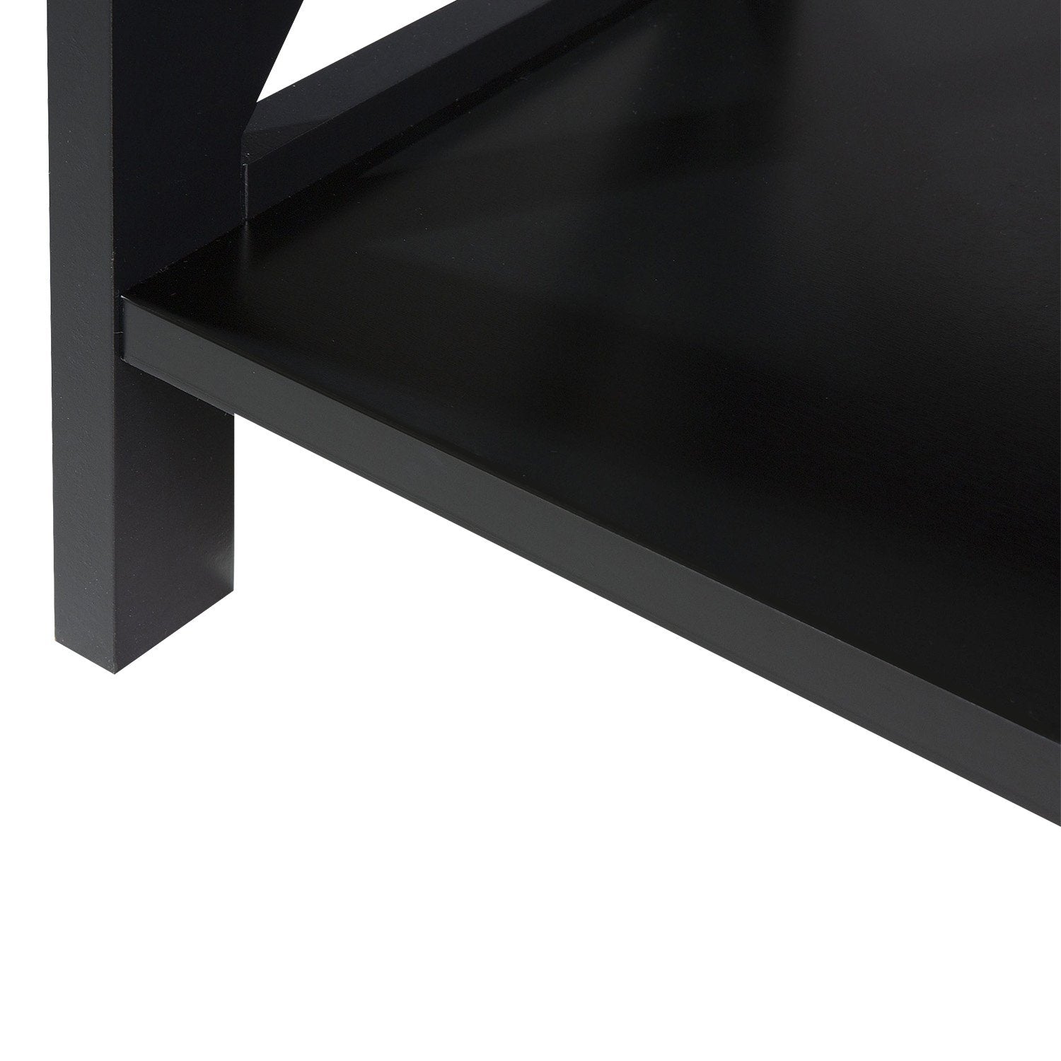 Close-up detail of lower corner of black X-frame bookshelf showing bottom shelf, leg and matte black surface finish
