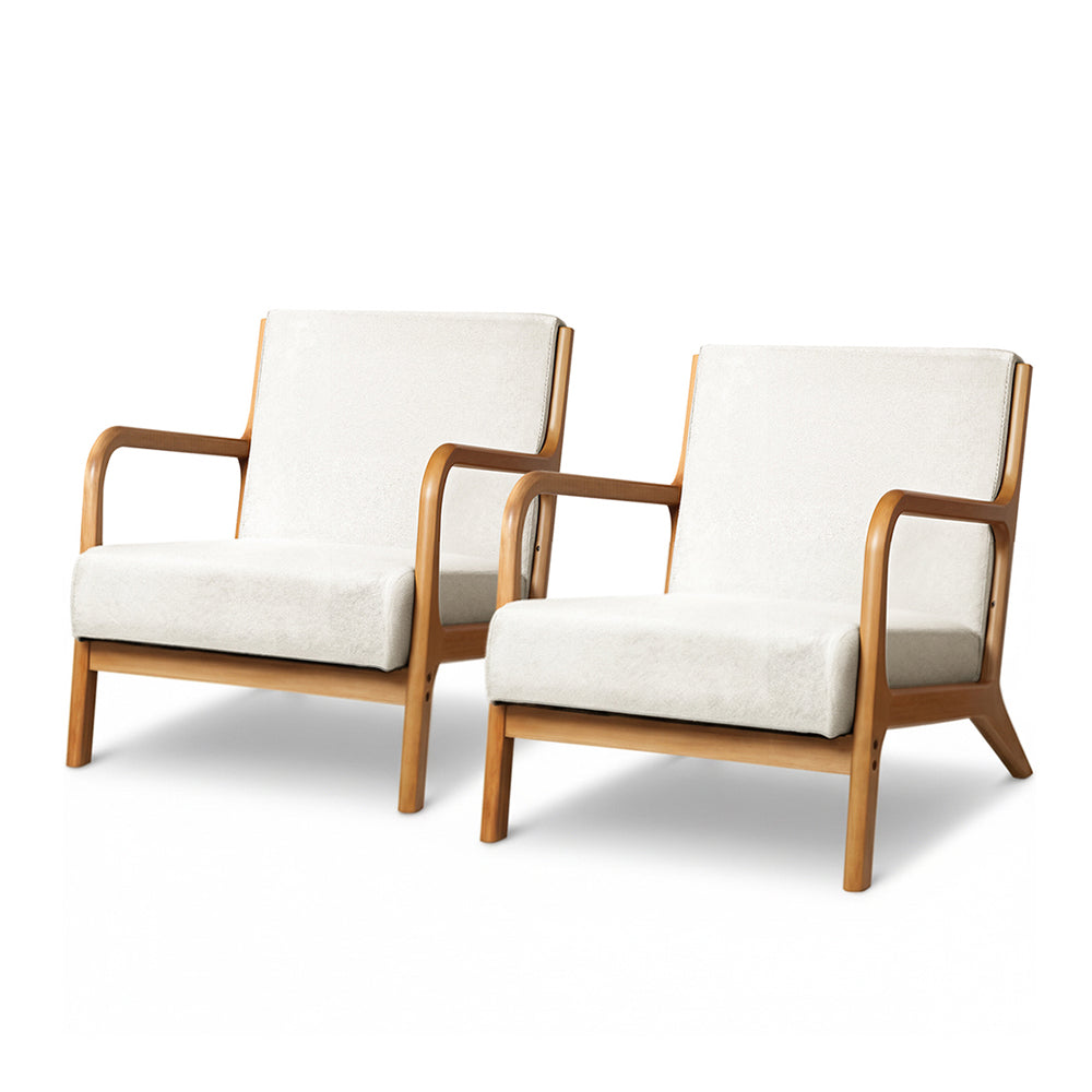 Pair of cream boucle upholstered armchairs with curved natural wood frames and splayed legs on white background