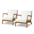Pair of cream boucle upholstered armchairs with curved natural wood frames and splayed legs on white background