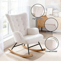 White boucle wingback rocking chair with callouts: high backrest, boucle fabric, curved armrest, in room by window