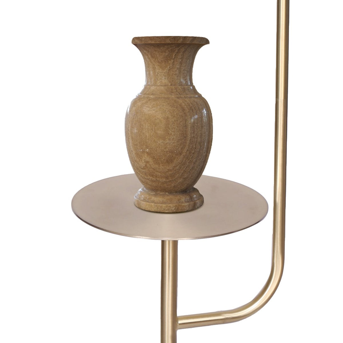 Floor lamp with curved brass arc arm, white tapered shade, round brass side table, and white marble base on white background