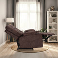 Brown fabric tufted recliner fully reclined with footrest extended, side view in living room with bookshelf and floor lamp