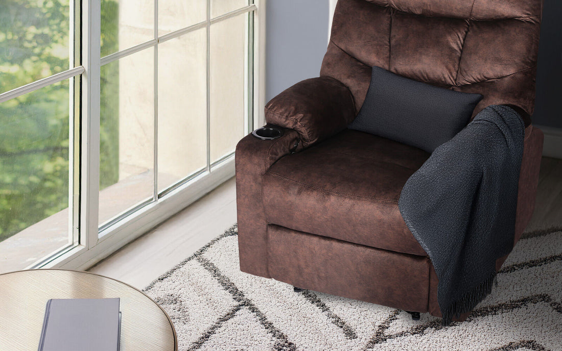 Brown fabric recliner with tufted backrest, two cup holders and side pocket, three-quarter angle view on white background