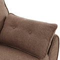 Close-up of brown linen button-tufted scatter pillow resting on rounded sofa arm