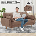 High-density foam infographic showing man seated on brown linen sofa in living room with 18cm foam depth callout