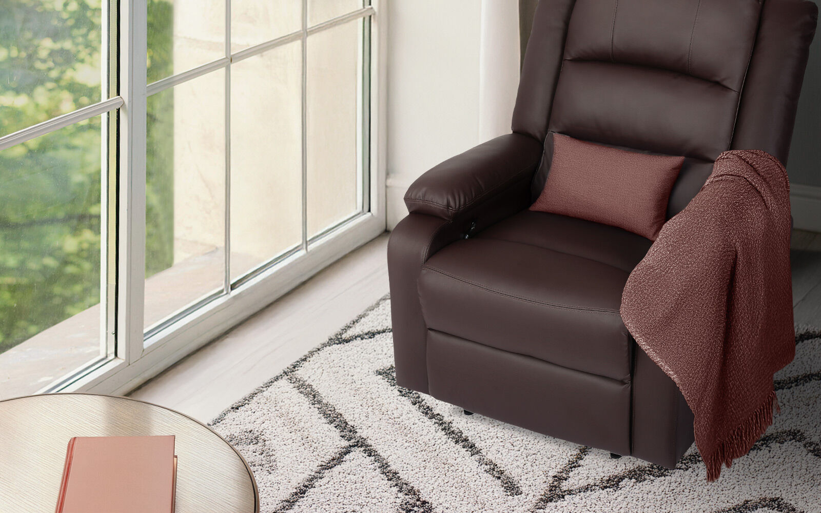 Dark brown PU leather recliner with red cushion and knitted throw draped over armrest beside large window on patterned rug