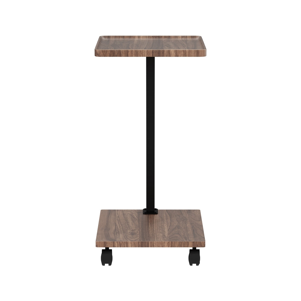 Side profile of C-shaped mobile side table, walnut wood top and base shelf, straight black post, two caster wheels