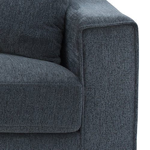 Close-up of charcoal chenille sofa left armrest and back cushion corner showing fabric texture