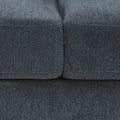 Close-up of charcoal chenille sofa showing the seam between two seat cushions and fabric texture