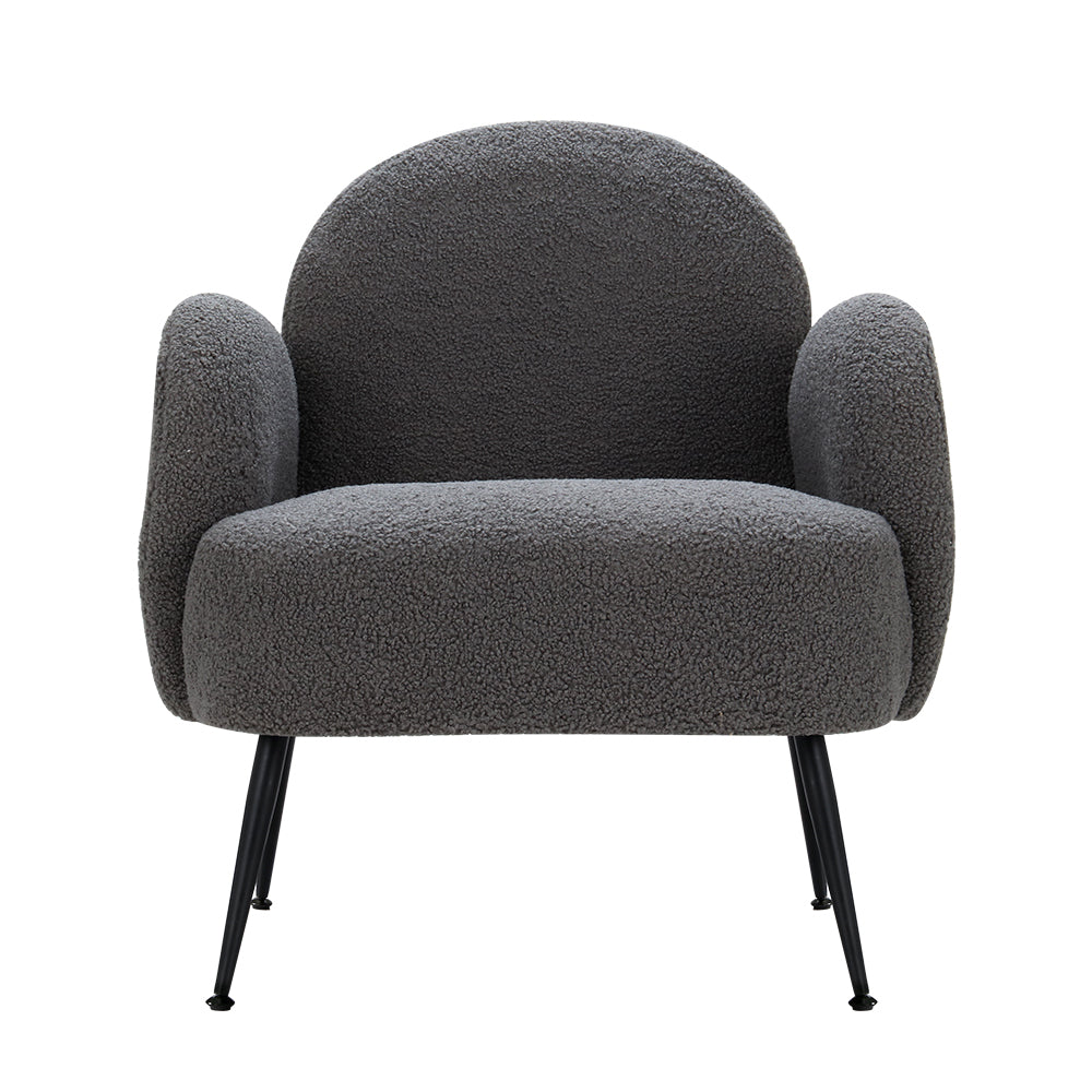 Charcoal grey boucle armchair with rounded arch back, curved armrests, and black metal legs, front view on white background