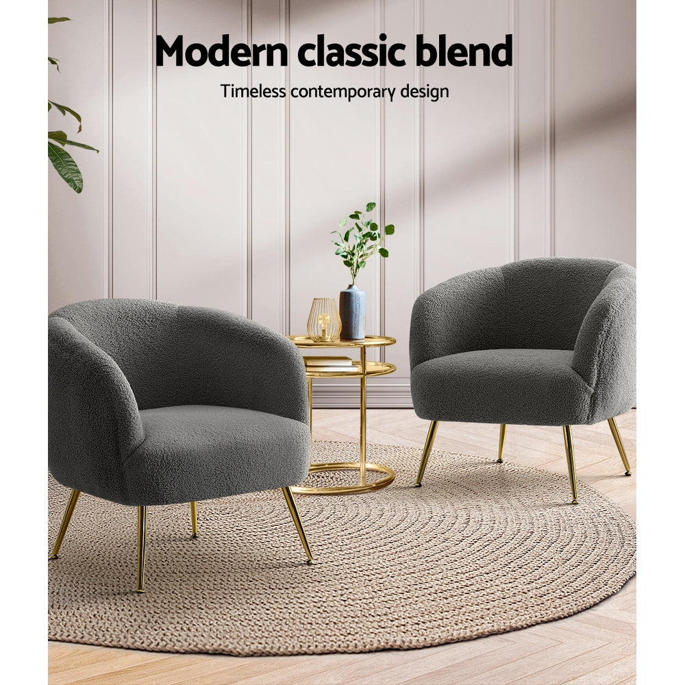 Two charcoal boucle tub chairs with gold legs facing each other, gold side table on jute rug, "Modern classic blend" text