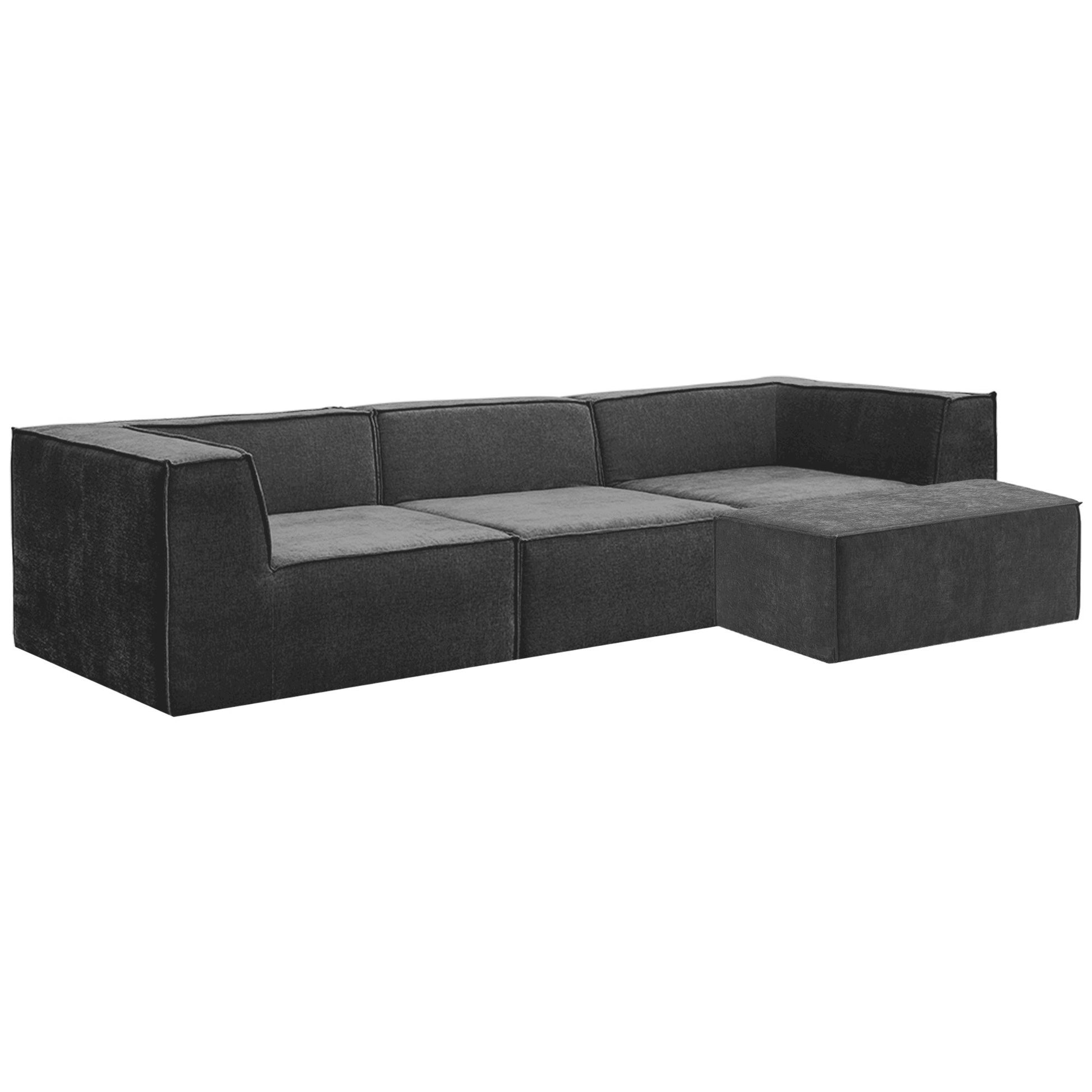 Dark charcoal modular 3-seater sofa with ottoman three-quarter angle view showing deep seat and modular structure