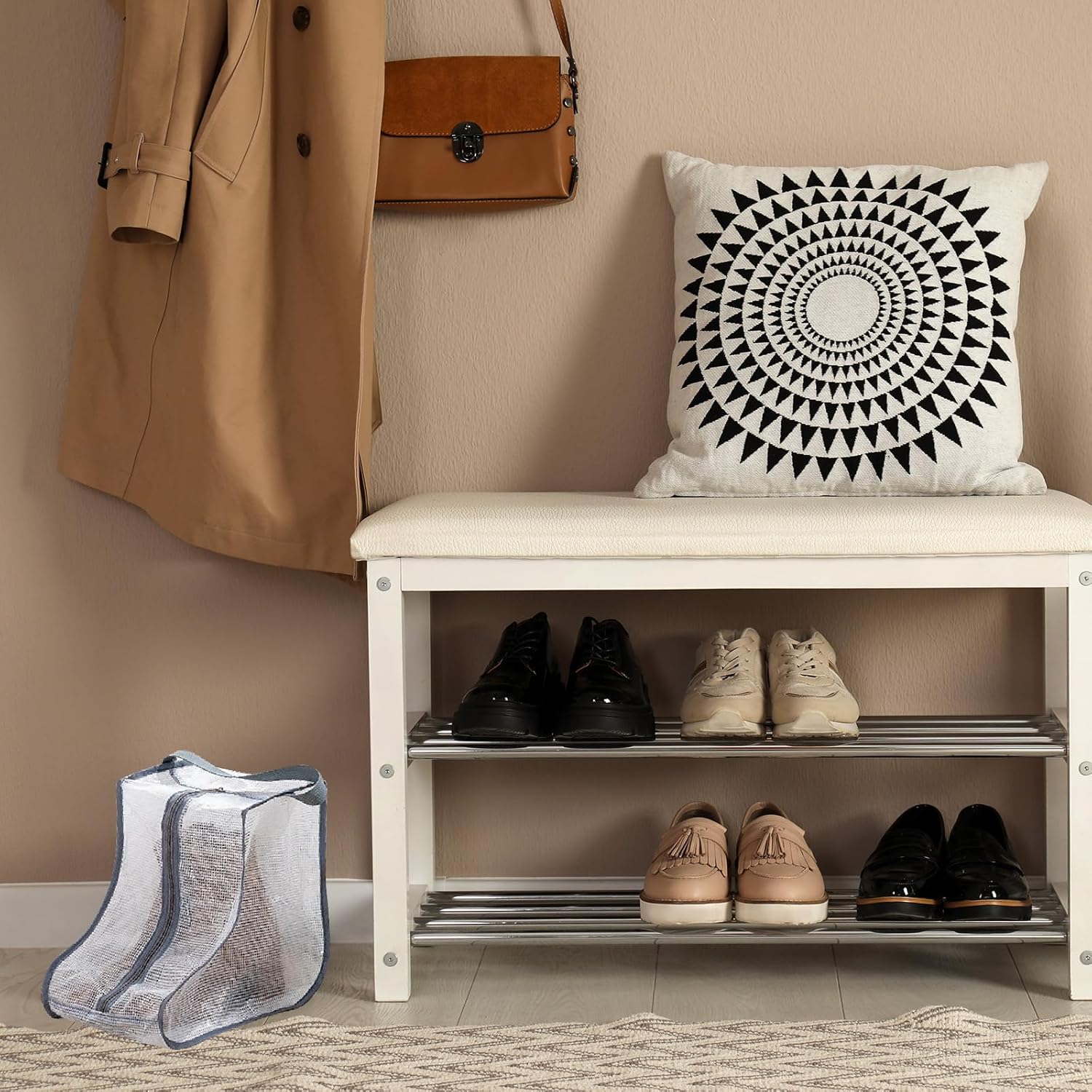 Grey-trim clear boot bag on entryway floor next to shoe bench rack with shoes coat and bag on wall hooks