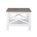End view of rectangular coffee table showing X-cross pattern on white end panel, grey wood-look top and lower white shelf