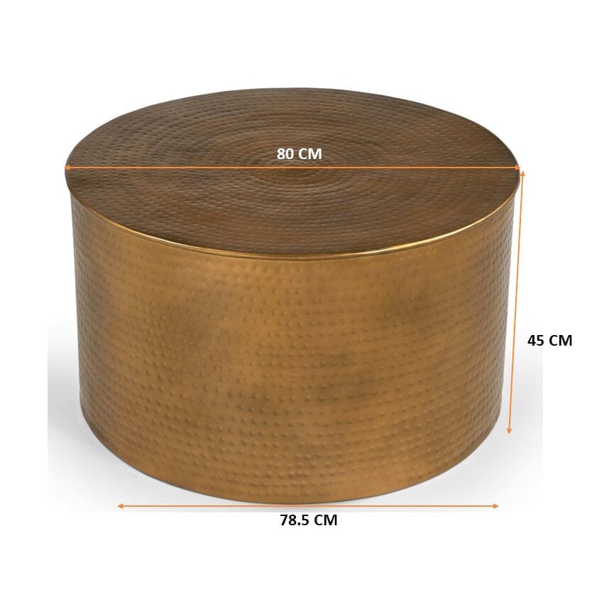 Oval wood-top table on a black metal frame with two dark navy fabric cube ottomans tucked underneath, angle view on white