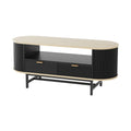 Oval coffee table with oak-effect top, black fluted side panels, two diagonal-pattern drawers, open shelf, and black metal