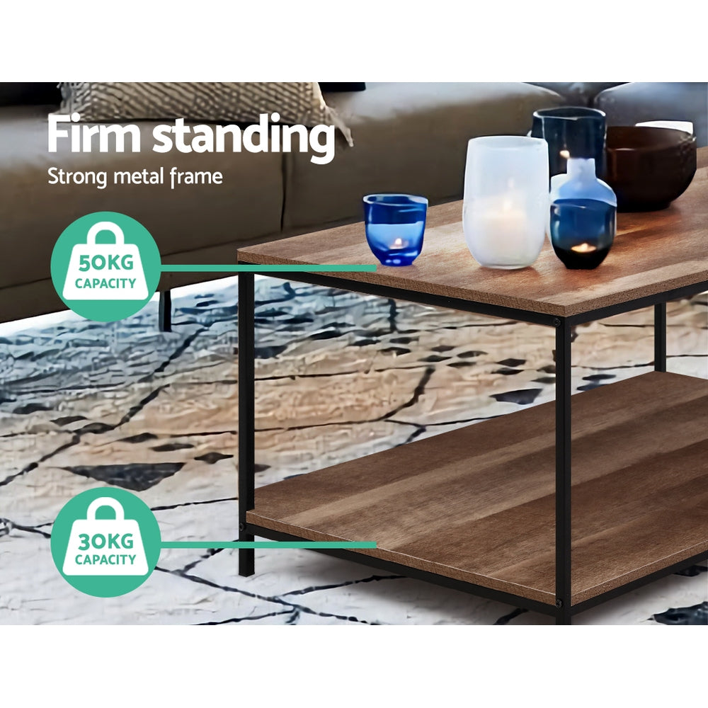 Close-up of two-tier rectangular coffee table corner showing wood-grain top and black metal frame, text: Firm standing,