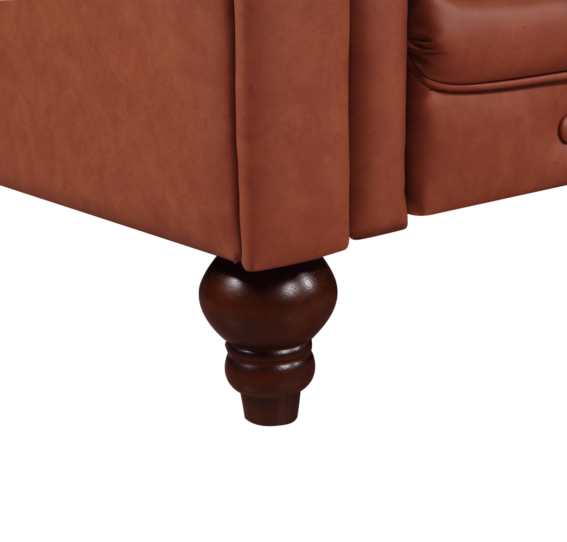 Tan cognac Chesterfield sofa dark walnut turned wooden leg close-up showing rounded spindle shape