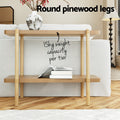 Round pinewood legs feature: two-shelf console behind sofa with 15kg per tier capacity callout, vase on top shelf