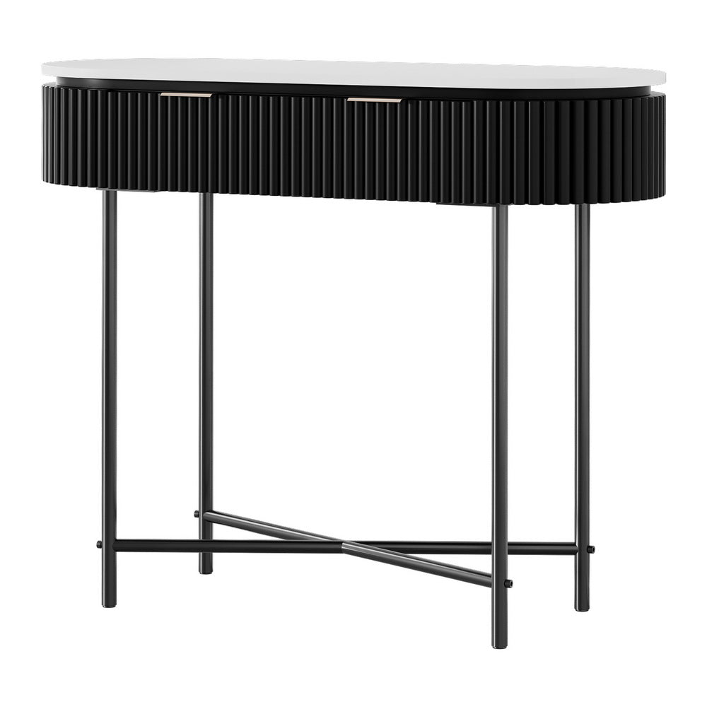 Console table three-quarter angle: white oval top, black fluted curved body with two silver bar handles, black X-frame legs