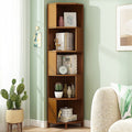 Five-tier corner bookcase in warm brown wood placed in a living room corner, styled with books, cactus, and ceramics
