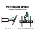 Full-motion corner TV bracket viewing options minus-4 to plus-33 degree tilt and 95mm to 520mm distance from wall diagram