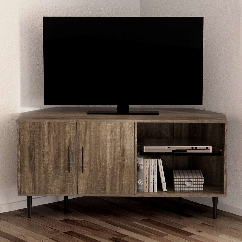 Greige wood corner TV unit with 2 doors on left 2 open shelves on right TV on top in room corner