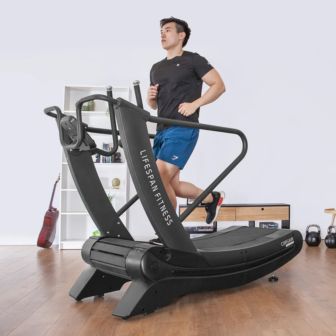 Corsair FreeRun 105 treadmill with curved frame and wide ribbed running deck on white background
