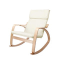 Cream fabric bentwood rocking armchair with headrest cushion and curved wood arms, angle view on white background