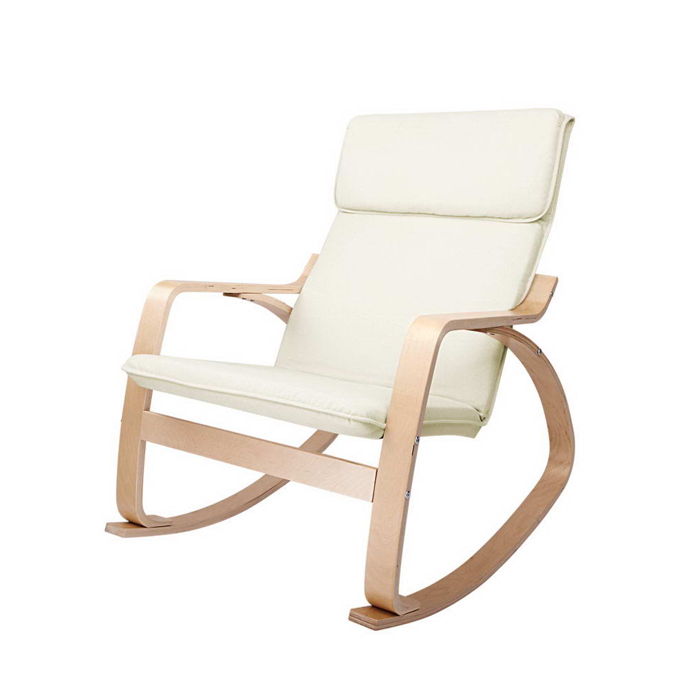 Cream fabric bentwood rocking armchair with headrest cushion and curved wood arms, angle view on white background