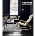 Cream bentwood rocking recliner in dark living room with sofa and patterned rug, text: Be swayed, Gentle and smooth motion