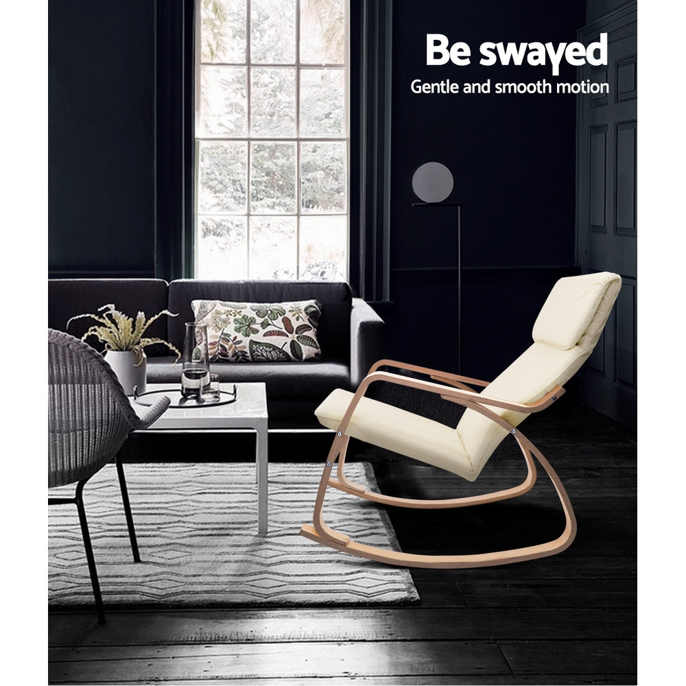 Cream bentwood rocking chair in dark living room with dark sofa, white coffee table and large window, text: Be swayed
