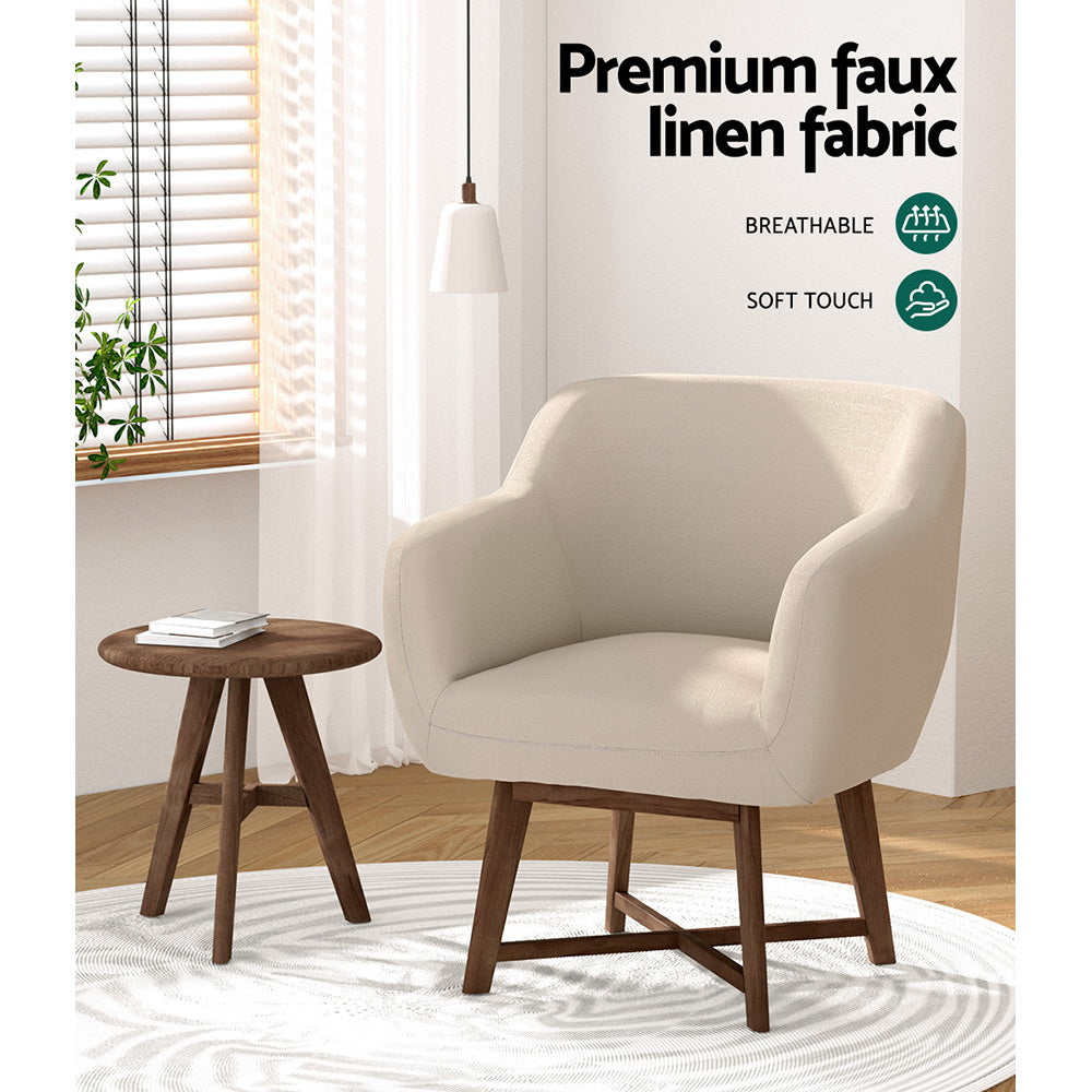Cream boucle V-frame armchair in green-walled room beside wooden sideboard, teacup on walnut armrest, inset of armrest detail