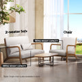Cream fabric 2-seater sofa (250kg capacity) and matching chair (150kg capacity) in living room scene with coffee table